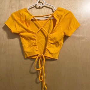 yellow open back crop top